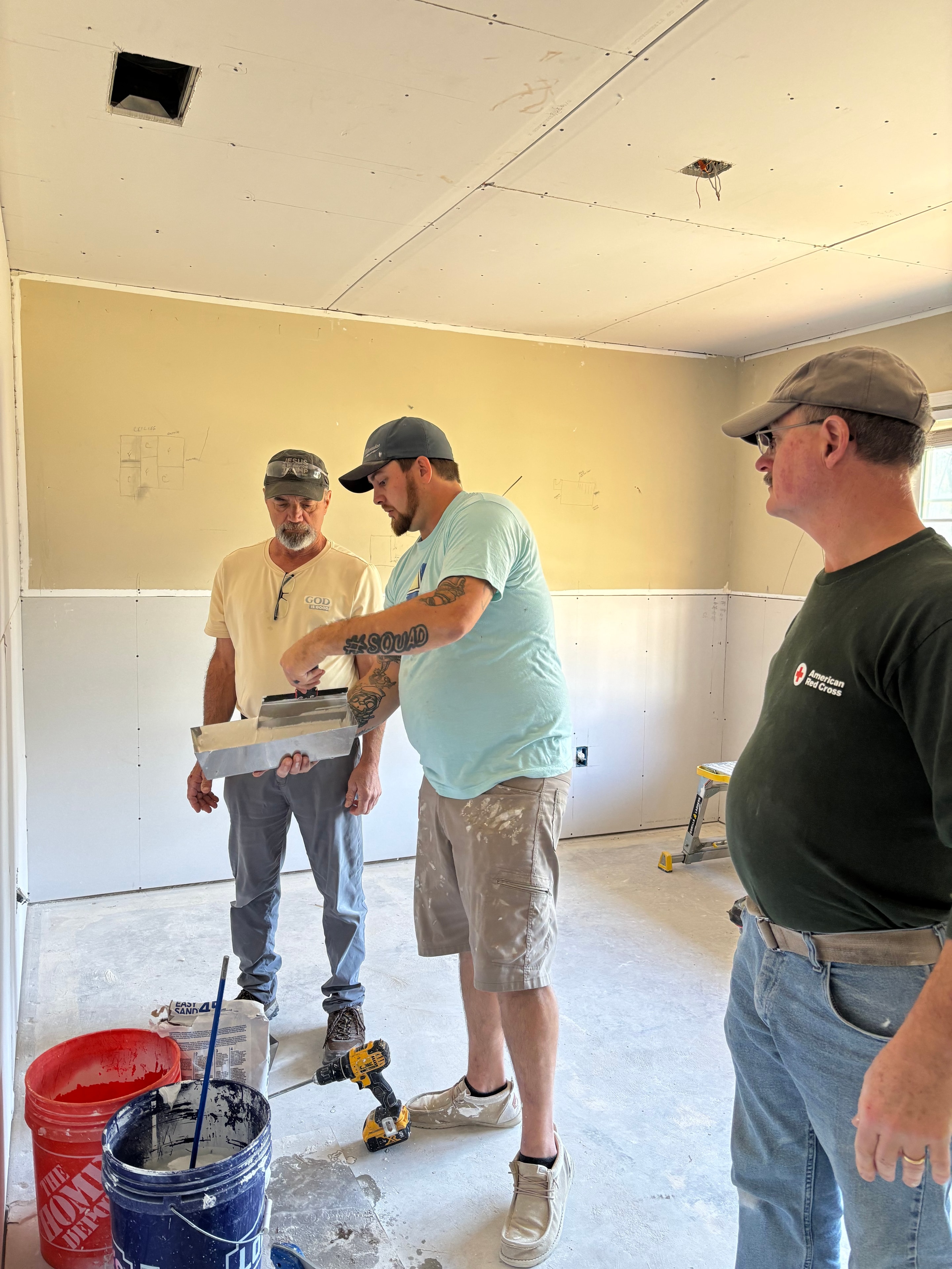 Faith Responders volunteers doing drywall work